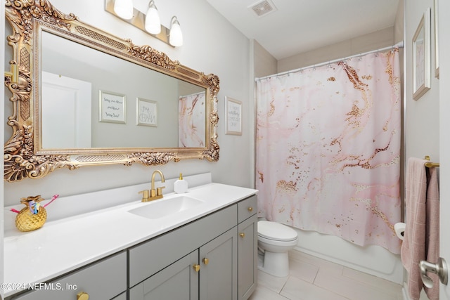 full bathroom with tile patterned flooring, shower / bath combo, vanity, and toilet