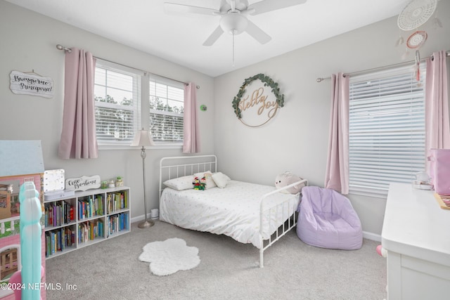 carpeted bedroom featuring ceiling fan