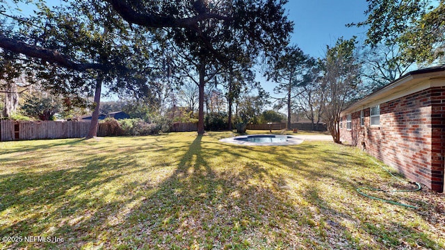 view of yard featuring a fenced backyard