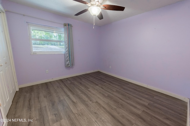 spare room featuring hardwood / wood-style floors and ceiling fan