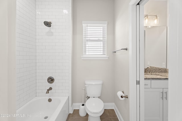 full bathroom featuring toilet, vanity, tile patterned floors, and tiled shower / bath