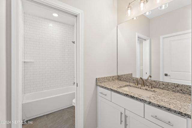 full bathroom with tile patterned flooring, vanity, toilet, and tiled shower / bath combo