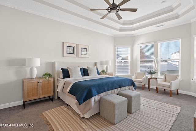 carpeted bedroom featuring a raised ceiling, ceiling fan, and crown molding