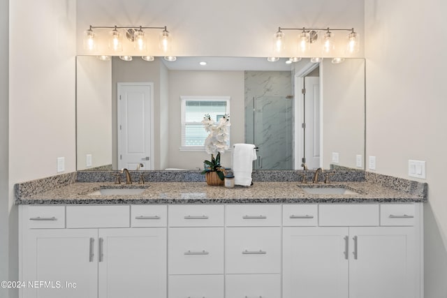 bathroom featuring vanity and an enclosed shower