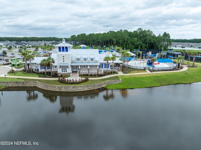 birds eye view of property with a water view