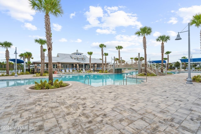 view of pool featuring a patio