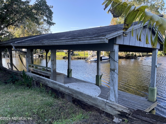 dock area featuring a water view