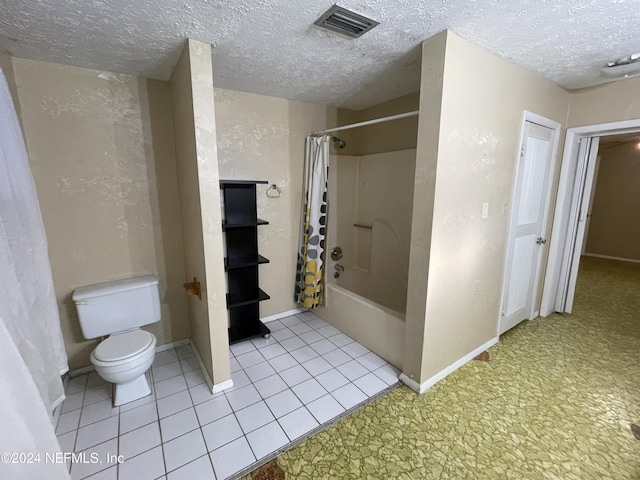 bathroom featuring tile patterned flooring, toilet, a textured ceiling, and shower / tub combo with curtain