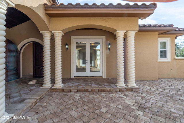 property entrance featuring french doors