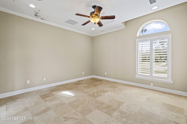 spare room with ornamental molding, ceiling fan, and a healthy amount of sunlight