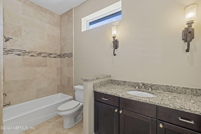 full bathroom with tile patterned flooring, vanity, toilet, and tiled shower / bath