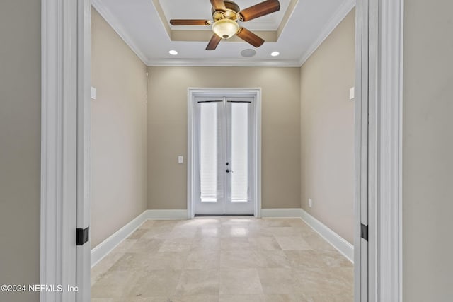 doorway to outside with ceiling fan, a raised ceiling, crown molding, and french doors