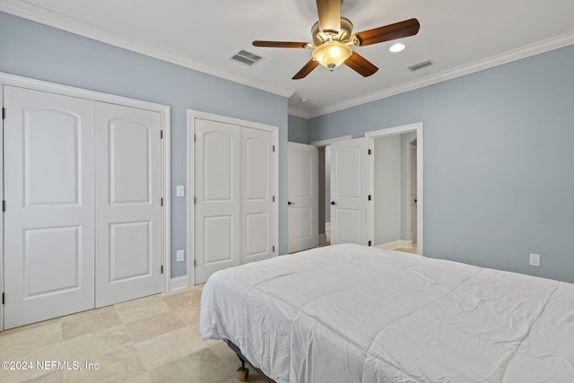 bedroom with ceiling fan, crown molding, and multiple closets