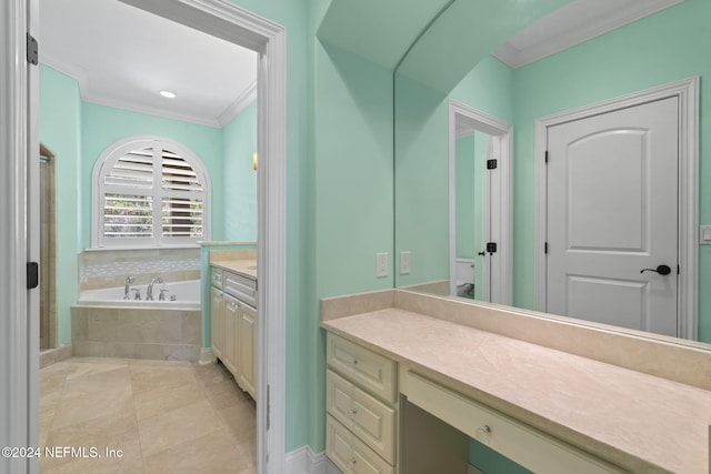 bathroom featuring tile patterned floors, tiled bath, crown molding, and vanity