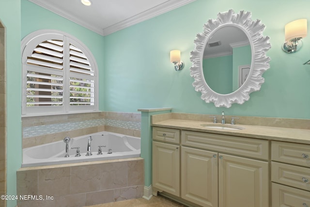 bathroom with vanity, crown molding, and tiled tub