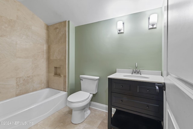 full bathroom featuring tile patterned flooring, vanity, tiled shower / bath combo, and toilet