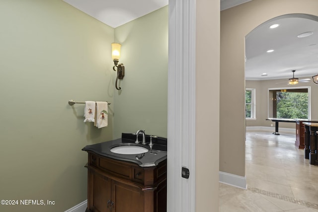 bathroom with ceiling fan, tile patterned flooring, and vanity