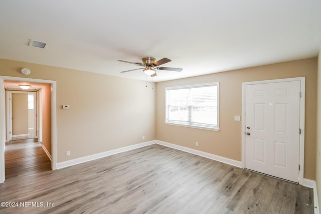 interior space with ceiling fan and light hardwood / wood-style flooring