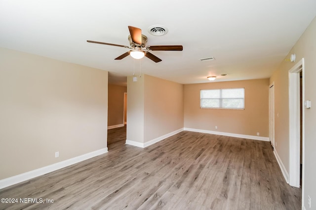 unfurnished room with light hardwood / wood-style flooring and ceiling fan