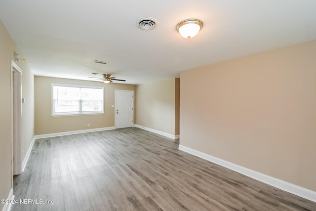 unfurnished room with light hardwood / wood-style floors and ceiling fan