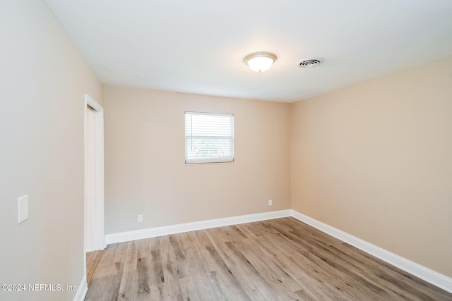 unfurnished room featuring light wood-type flooring