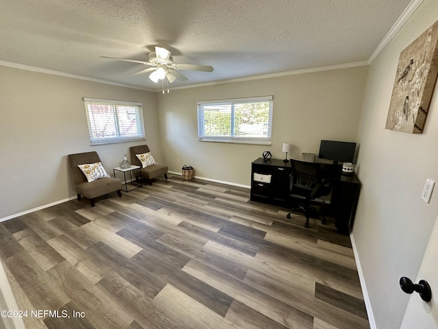 office space featuring a textured ceiling, ceiling fan, ornamental molding, and wood-type flooring