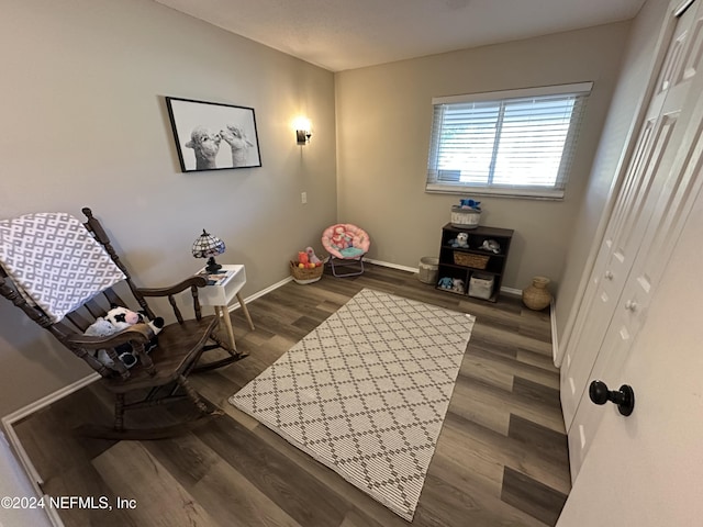 sitting room with dark hardwood / wood-style floors