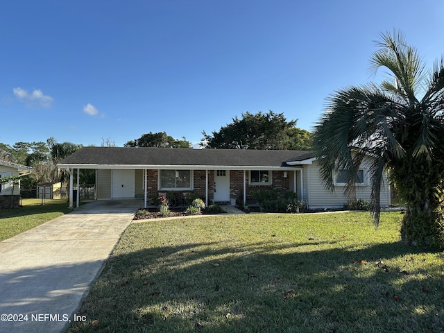 ranch-style home with a front lawn and a carport