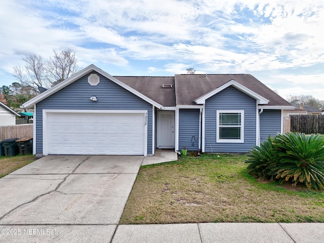 ranch-style house with a garage and a front lawn