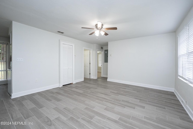 unfurnished room featuring light hardwood / wood-style flooring and ceiling fan