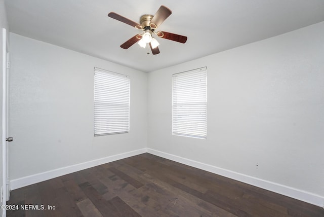 unfurnished room featuring ceiling fan and dark hardwood / wood-style flooring