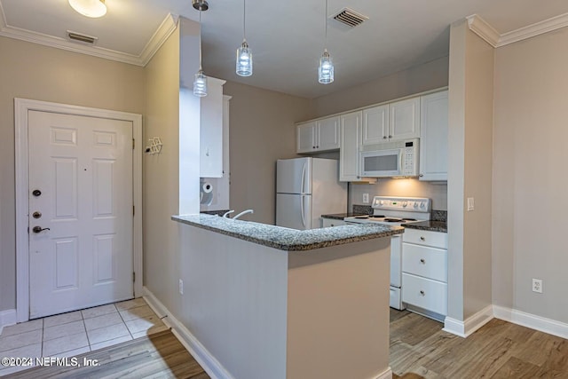 kitchen with kitchen peninsula, white appliances, crown molding, light hardwood / wood-style floors, and white cabinetry