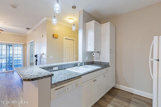 kitchen featuring white cabinets, white appliances, kitchen peninsula, and sink