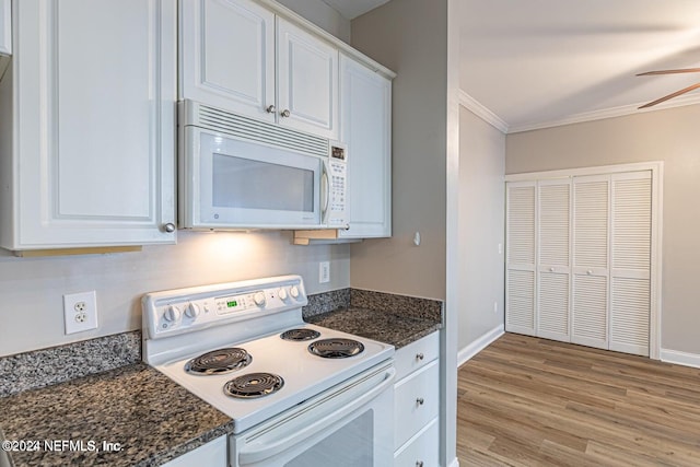 kitchen with white cabinetry, light hardwood / wood-style floors, white appliances, and ornamental molding