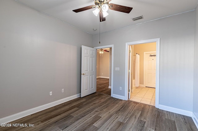 unfurnished bedroom featuring ceiling fan and wood-type flooring