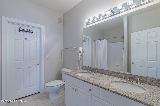 full bathroom featuring tile patterned floors, vanity, toilet, and shower / tub combo with curtain