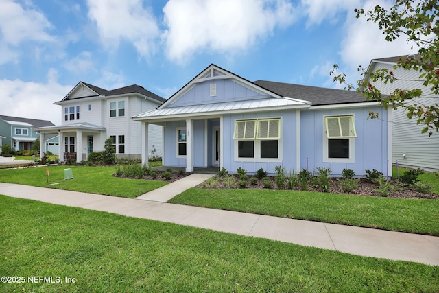 166 Blue Hampton Dr, Ponte Vedra, FL 32081 - view of front of house featuring board and batten siding, a porch, and a front lawn