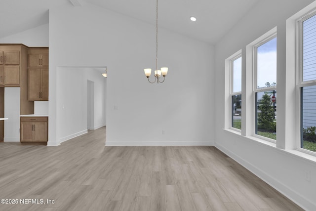166 Blue Hampton Dr, Ponte Vedra, FL 32081 - unfurnished dining area with a chandelier, light wood finished floors, baseboards, and high vaulted ceiling