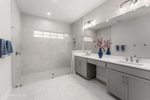 bathroom featuring vanity and a tile shower