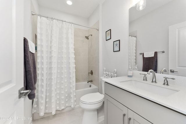 full bathroom with toilet, vanity, tile patterned floors, and shower / tub combo with curtain