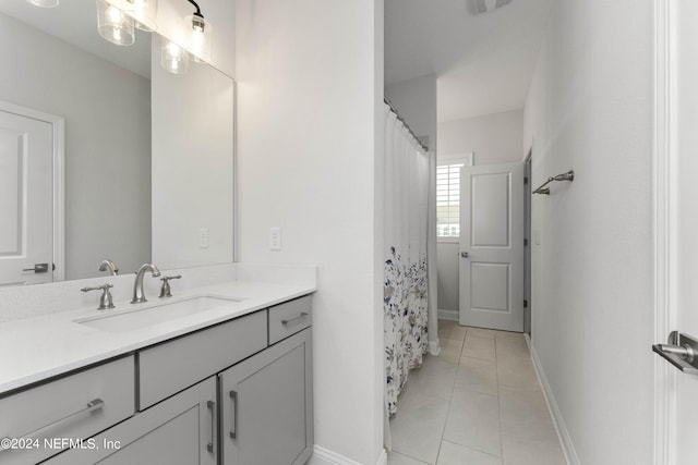 bathroom with a shower with curtain, tile patterned flooring, and vanity