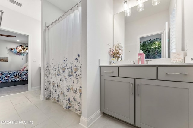 bathroom featuring tile patterned flooring and vanity