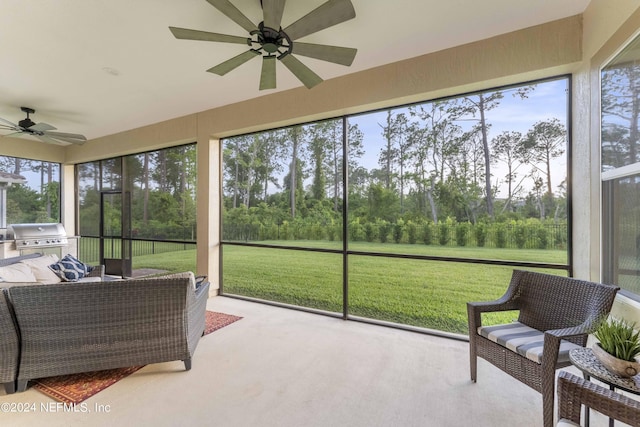 sunroom / solarium with ceiling fan and plenty of natural light