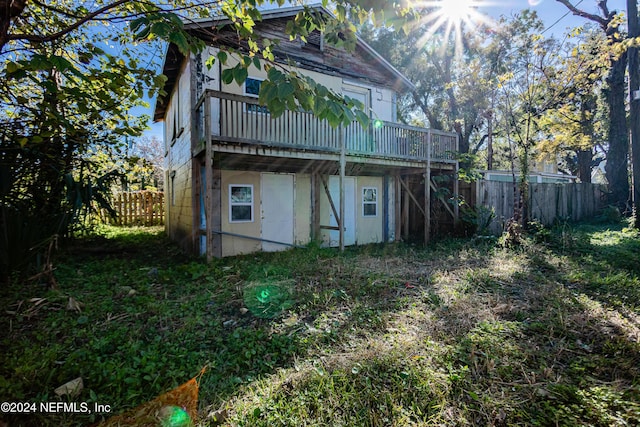 back of house featuring a deck