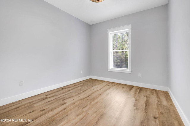 spare room featuring light wood-type flooring