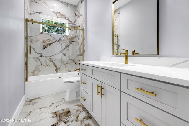 full bathroom featuring combined bath / shower with glass door, vanity, and toilet