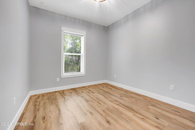 unfurnished room featuring light wood-type flooring