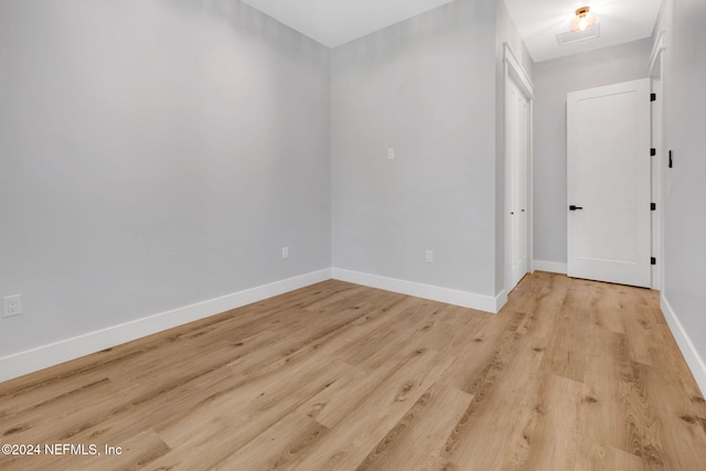 spare room with light wood-type flooring