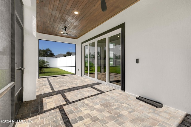 unfurnished sunroom with wood ceiling