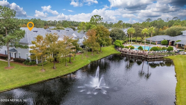 birds eye view of property featuring a water view